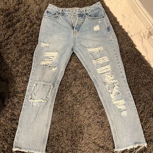 Blue ripped jeans size 7 or 8 in women’s. Only been worn 2 times,Recently bought